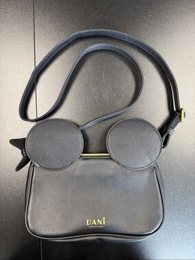 Danielle Nicole Black Crossbody Bag with Round Flap Accents